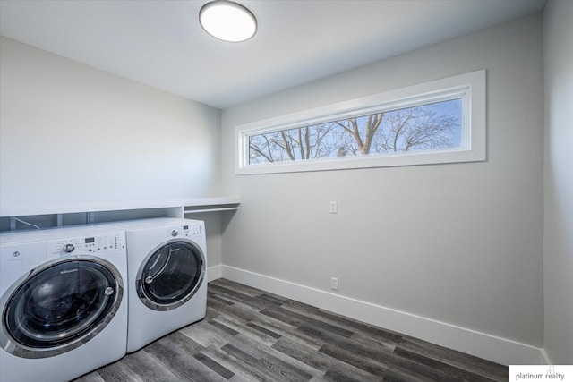 laundry room featuring washer and clothes dryer and dark hardwood / wood-style flooring