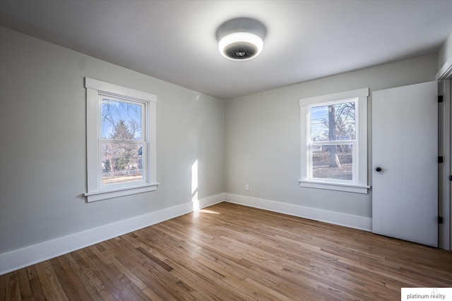 empty room featuring hardwood / wood-style flooring