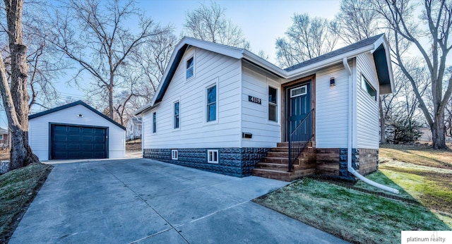 view of front facade with a garage and an outdoor structure