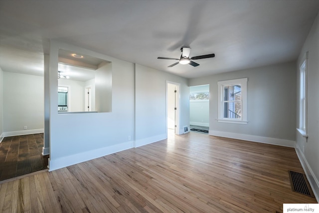 spare room featuring dark hardwood / wood-style floors and ceiling fan