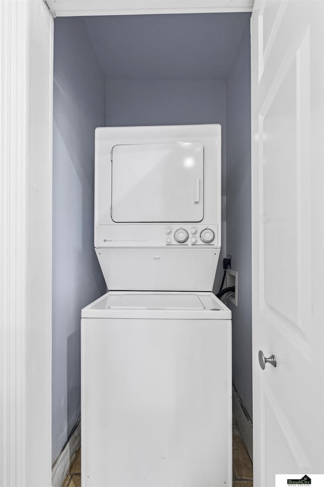 laundry room featuring stacked washing maching and dryer