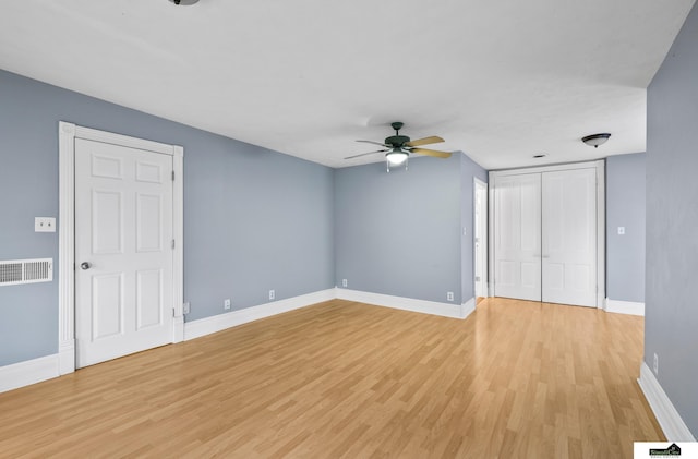 unfurnished room featuring ceiling fan and light hardwood / wood-style floors