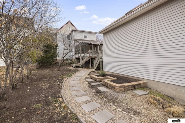 view of yard with a sunroom