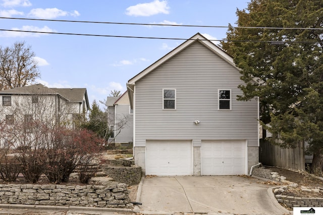 view of side of home with a garage