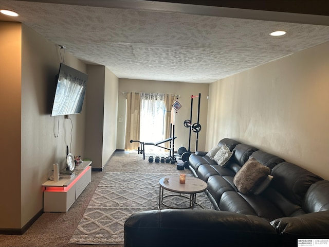 living room with a textured ceiling and light colored carpet