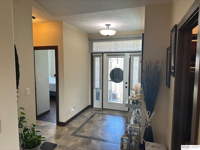 entrance foyer with a textured ceiling