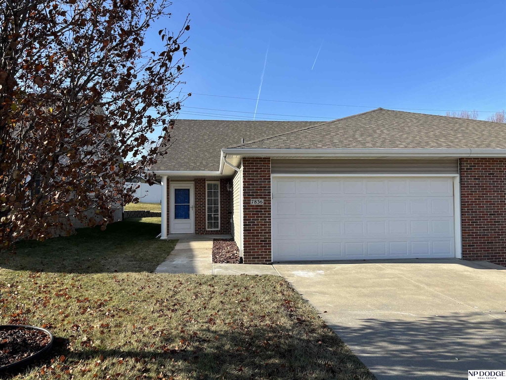 ranch-style home with a garage