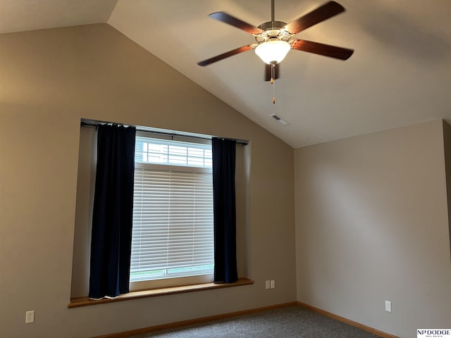 unfurnished room featuring carpet flooring, ceiling fan, and vaulted ceiling