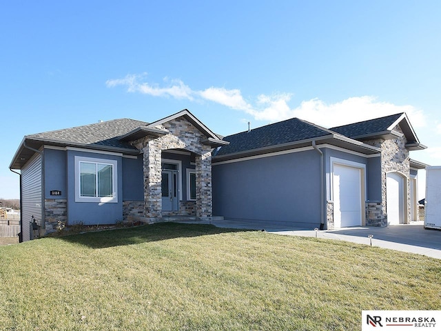 prairie-style house with a front yard and a garage