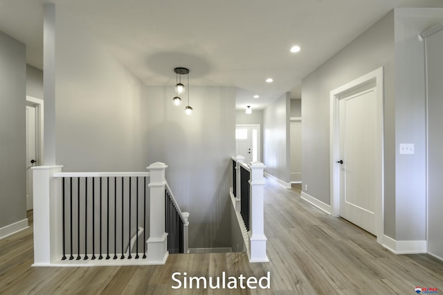 staircase with hardwood / wood-style flooring