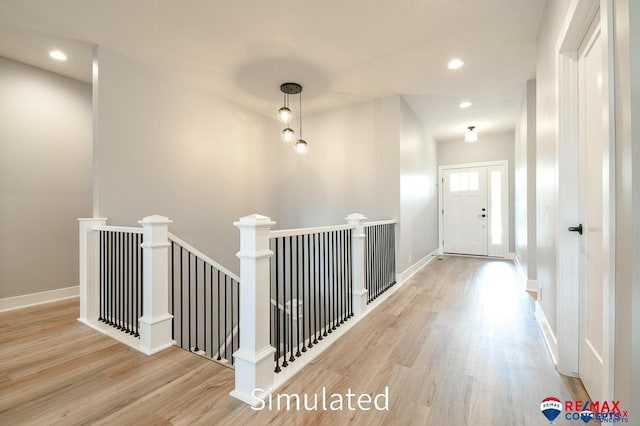 hall with light hardwood / wood-style floors