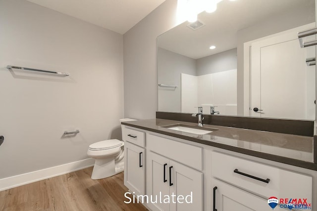 bathroom with a shower, wood-type flooring, vanity, and toilet