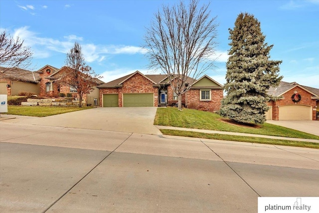 view of front of house featuring a front yard and a garage