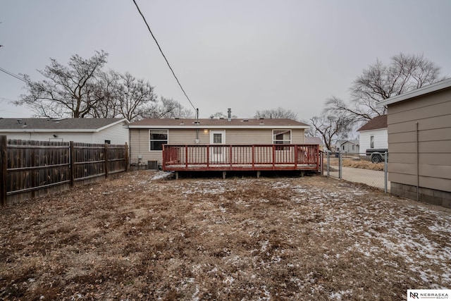 back of property featuring a deck