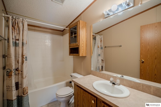 full bathroom featuring vanity, crown molding, toilet, shower / bath combo with shower curtain, and a textured ceiling