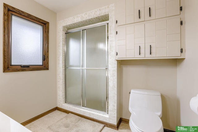 bathroom with toilet and an enclosed shower