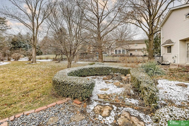 view of yard layered in snow