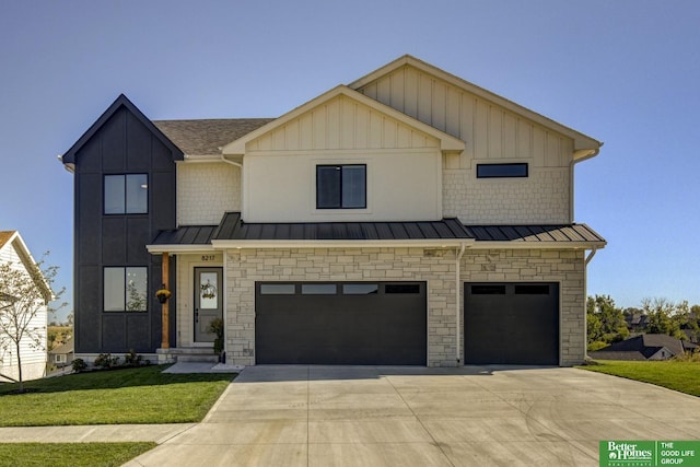 view of front of property featuring a garage and a front yard