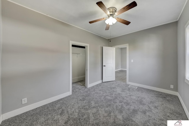 unfurnished bedroom with carpet flooring, a closet, and ceiling fan