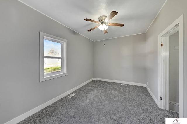 empty room with ceiling fan and carpet floors