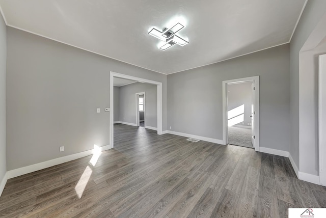 empty room featuring dark hardwood / wood-style floors