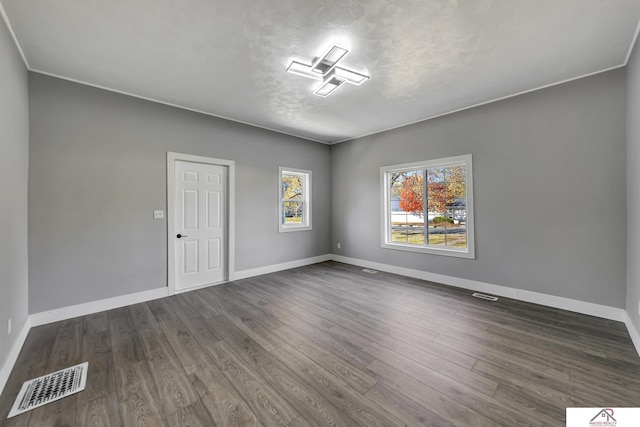 unfurnished room featuring dark wood-type flooring