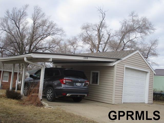 garage with a carport