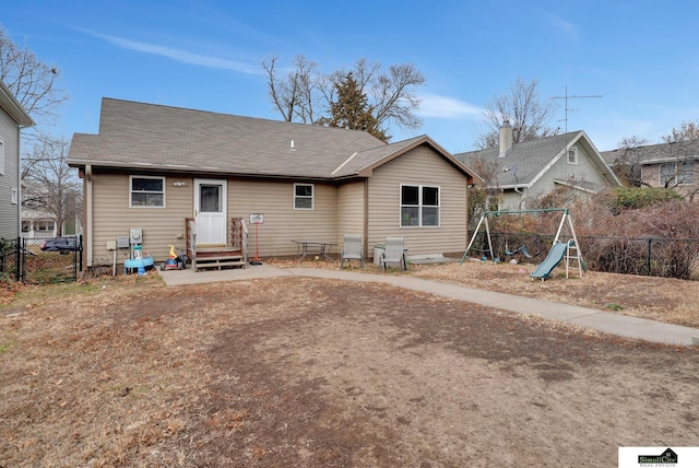 rear view of house with a playground