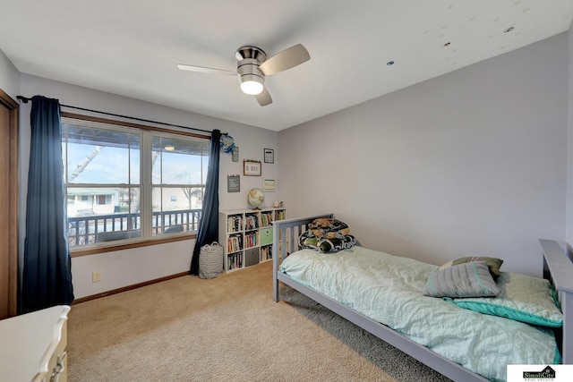 bedroom featuring ceiling fan and light colored carpet