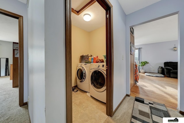 washroom with light colored carpet and washer and dryer