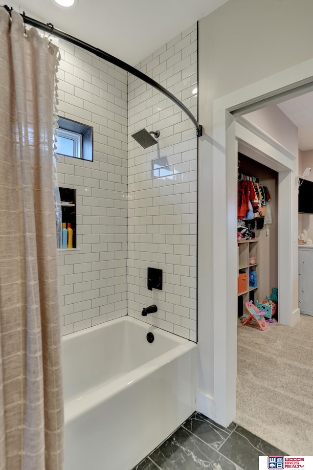 bathroom with shower / bath combo with shower curtain