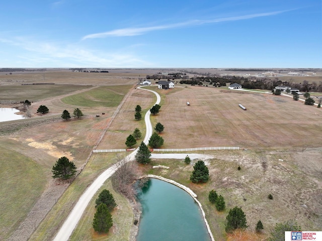 drone / aerial view with a rural view and a water view