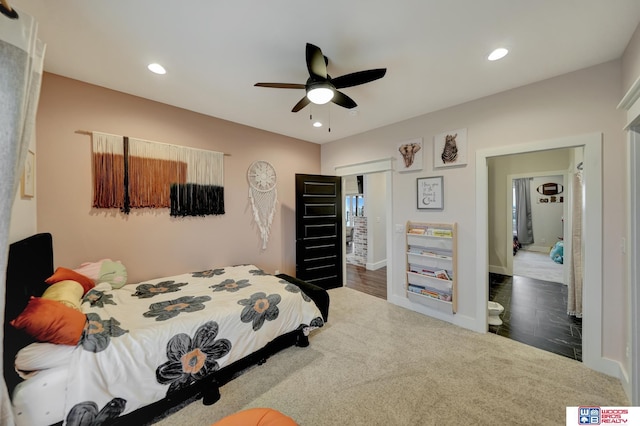 bedroom with ceiling fan and dark carpet