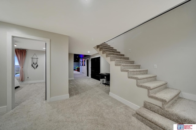 stairs featuring carpet floors