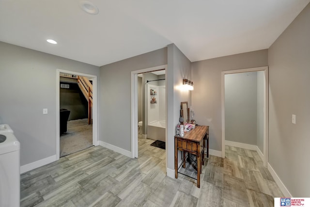 corridor featuring light hardwood / wood-style flooring