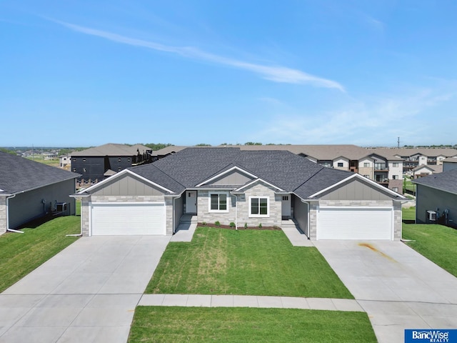 ranch-style home with a front yard and a garage