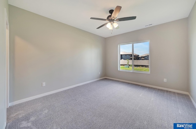 unfurnished room with ceiling fan and carpet floors