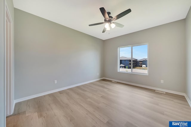 unfurnished room with ceiling fan and light hardwood / wood-style floors