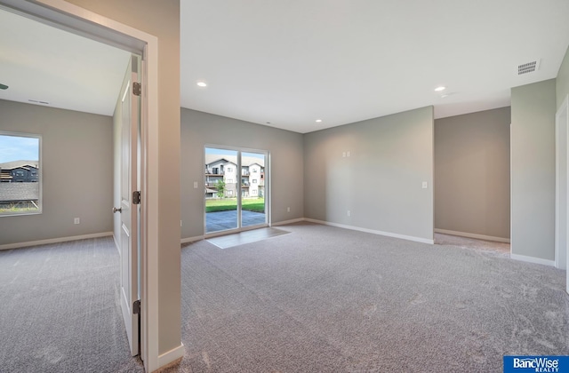 spare room with light colored carpet