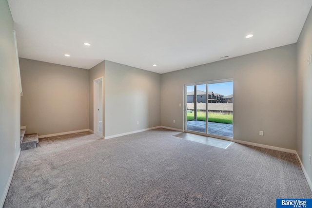 unfurnished room featuring light colored carpet