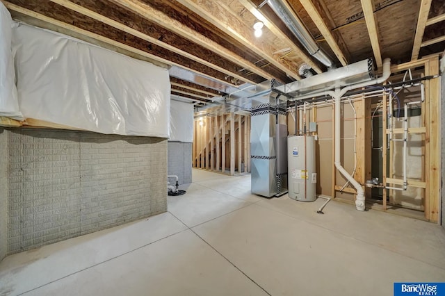 basement with heating unit and electric water heater