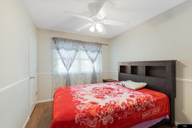 bedroom featuring dark hardwood / wood-style floors and ceiling fan