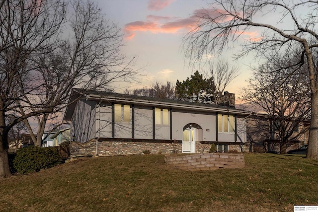 view of front of home with a yard