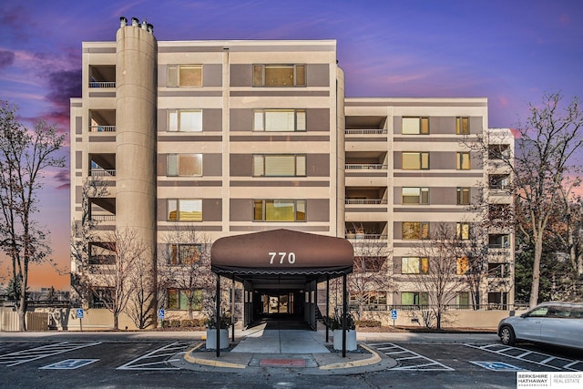 view of outdoor building at dusk