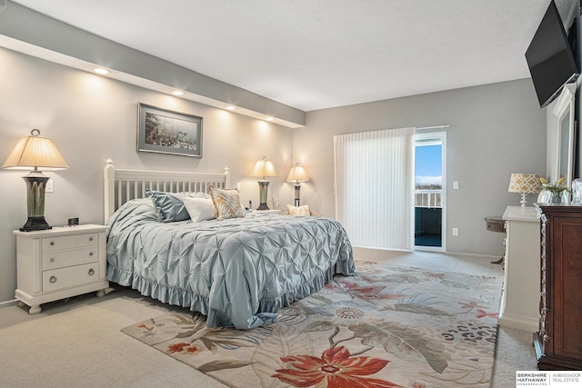 carpeted bedroom with access to outside