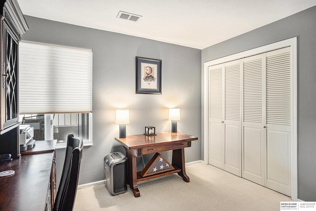 office area featuring light colored carpet