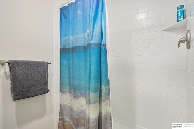 bathroom featuring a shower with curtain