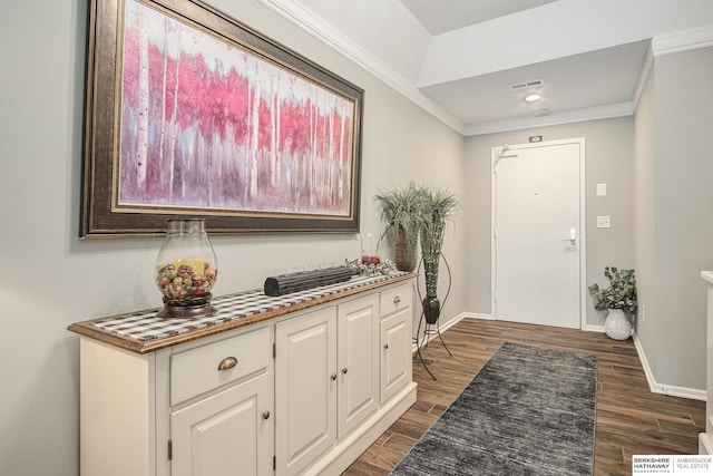 foyer entrance featuring dark hardwood / wood-style floors and crown molding