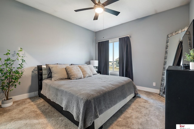 bedroom with ceiling fan and light colored carpet