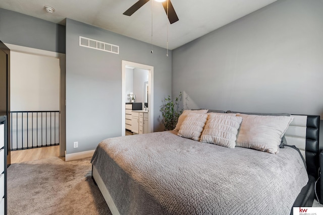 carpeted bedroom featuring ensuite bathroom and ceiling fan